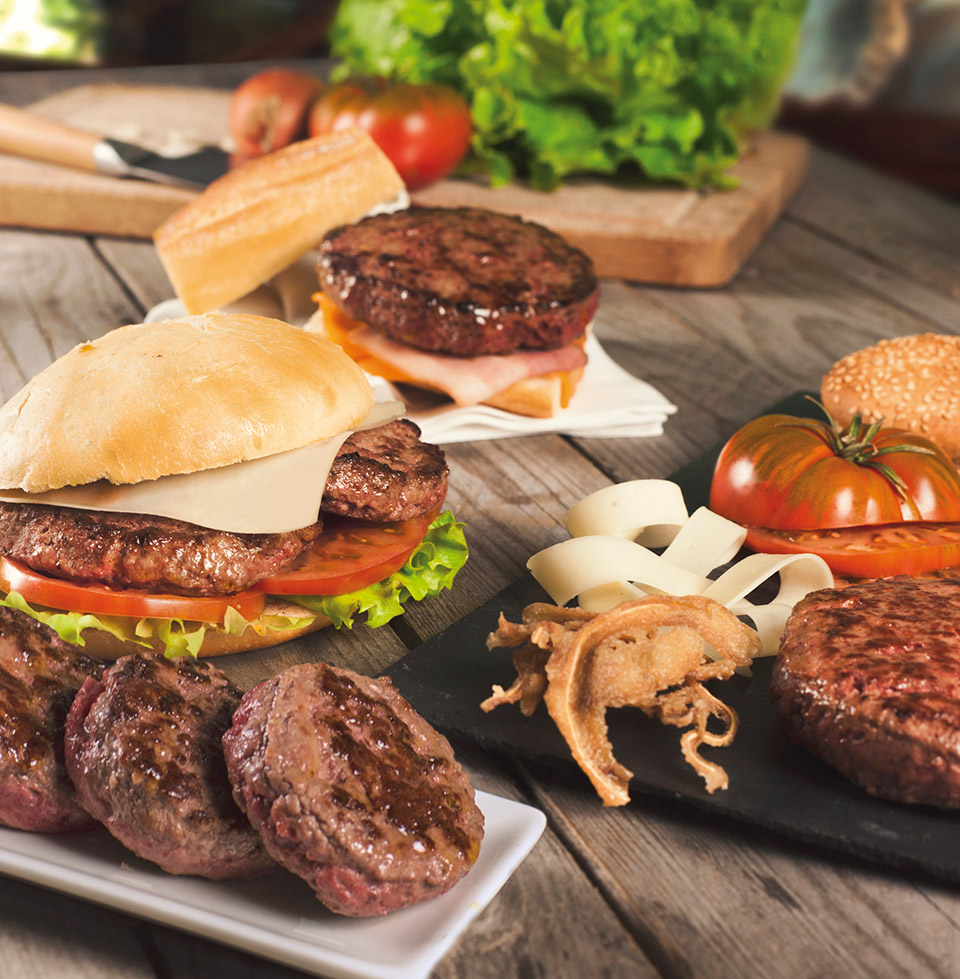 Hamburguesas completas con pan de burger.
